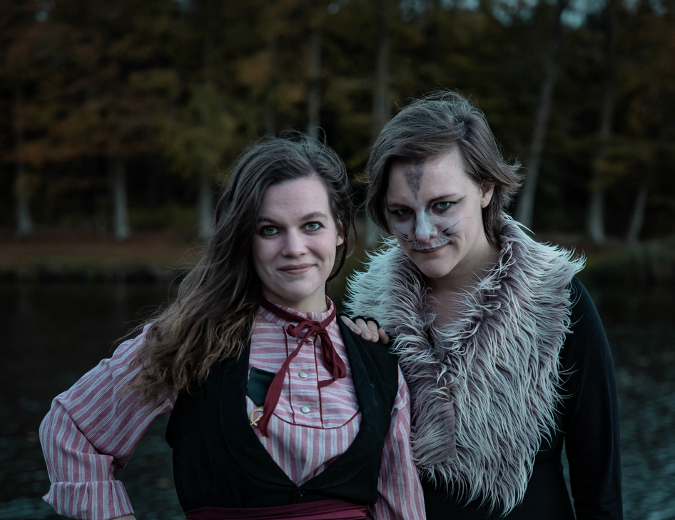 A portrait of a woman and her daemon.